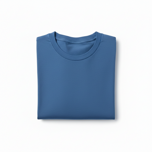 Folded blue shirt, crew neck, soft fabric, simple design, on white background.