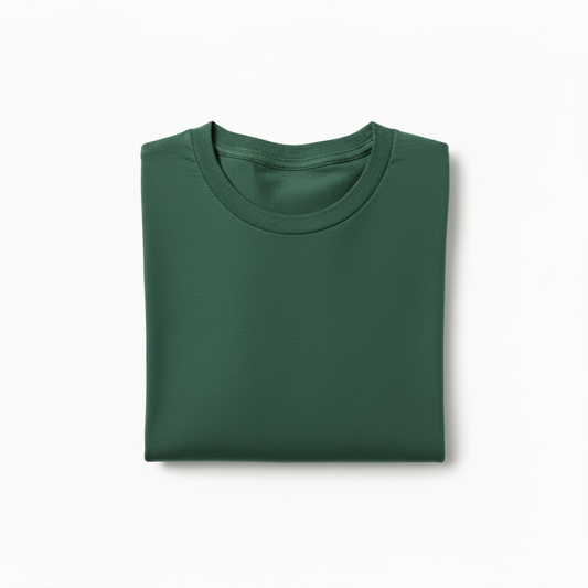 Folded green shirt, round neck, plain texture, viewed from above on a white background.