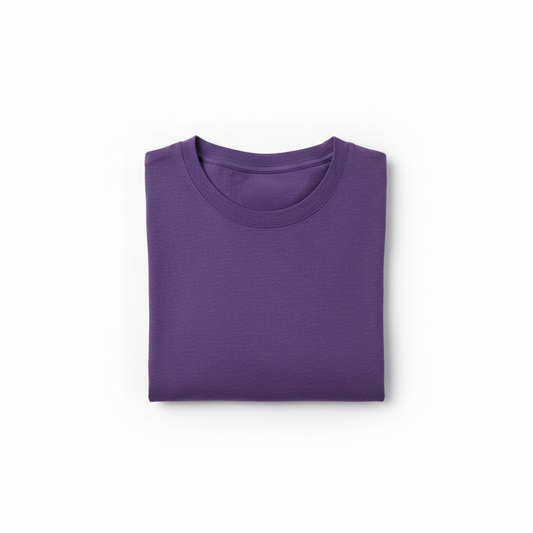 Folded purple shirt with a crew neck, smooth fabric texture, neatly placed against a white background.